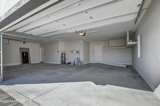 garage with a garage door opener and water heater