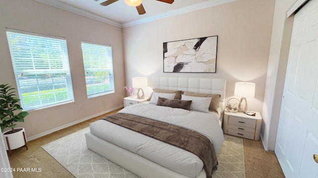 bedroom featuring ceiling fan, light colored carpet, and ornamental molding