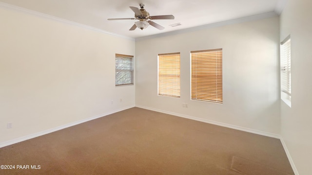 spare room with carpet flooring, ceiling fan, and ornamental molding