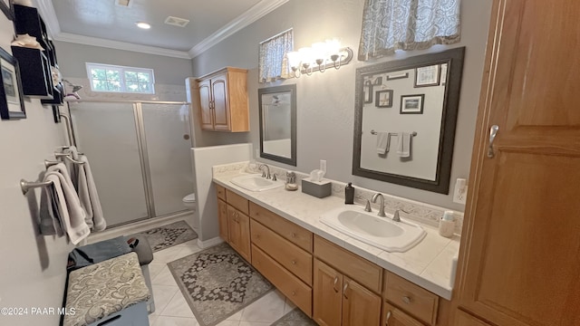 bathroom with tile patterned floors, an enclosed shower, vanity, crown molding, and toilet