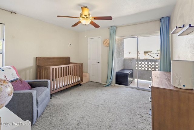 bedroom featuring light carpet, access to outside, and a ceiling fan