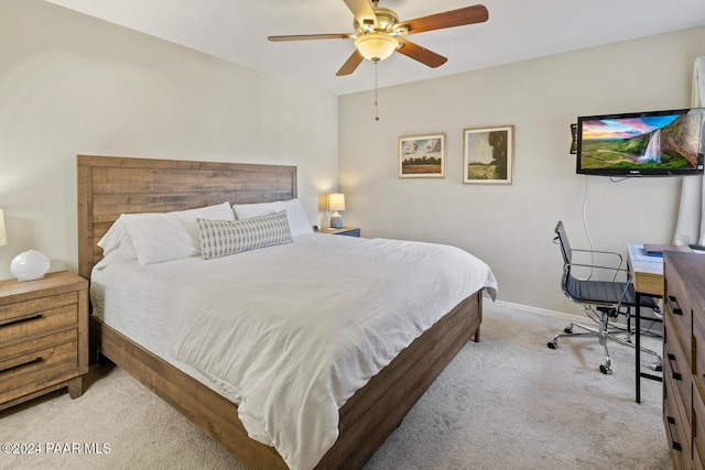 bedroom featuring light carpet, ceiling fan, and baseboards