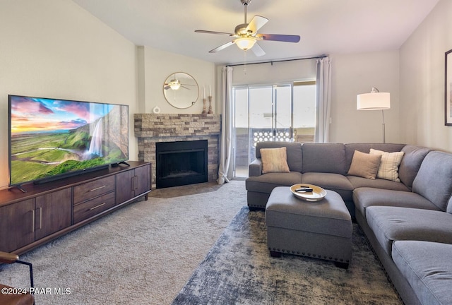 living area with carpet floors, ceiling fan, and a fireplace with flush hearth