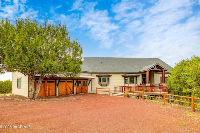 2667 N Overlook Dr, Williams, AZ 86046 - back of property with a deck, driveway, and roof with shingles