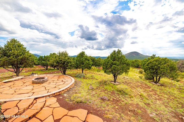 2667 N Overlook Dr, Williams, AZ 86046 - view of yard featuring an outdoor fire pit, a patio area, and a mountain view