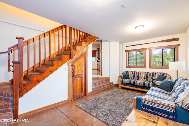 2667 N Overlook Dr, Williams, AZ 86046 - living room featuring stairs and baseboards