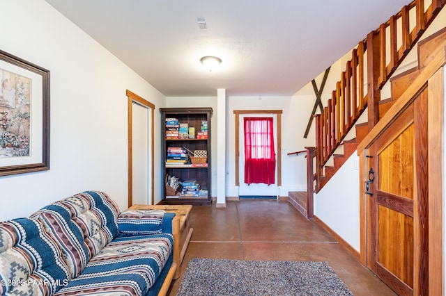 2667 N Overlook Dr, Williams, AZ 86046 - foyer entrance with finished concrete flooring, stairs, and baseboards
