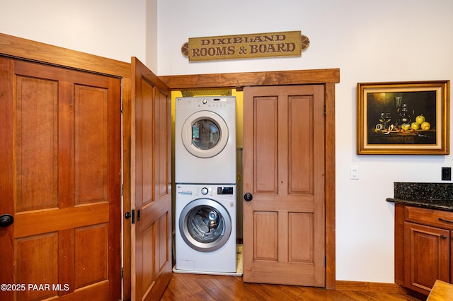 2667 N Overlook Dr, Williams, AZ 86046 - washroom featuring stacked washing machine and dryer and dark wood-type flooring