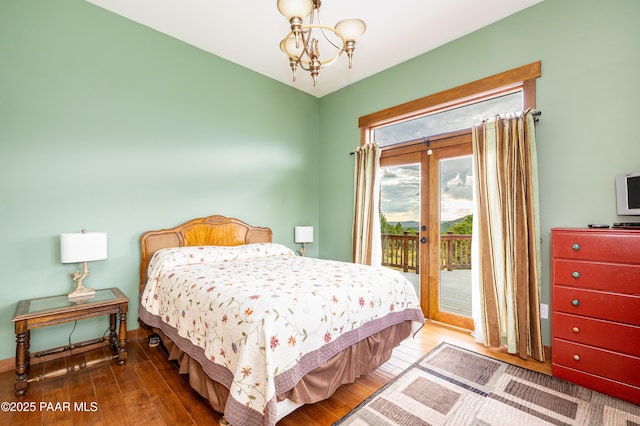2667 N Overlook Dr, Williams, AZ 86046 - bedroom with a chandelier, access to outside, and wood-type flooring
