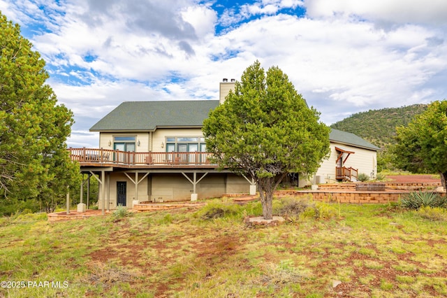 2667 N Overlook Dr, Williams, AZ 86046 - rear view of house featuring a deck and a chimney