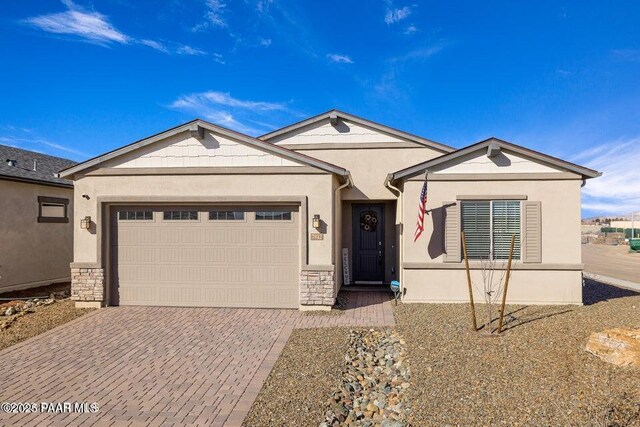 7942 E Carbon Ct Unit 20-A, Prescott Valley, AZ 86315 - single story home with decorative driveway, a garage, stucco siding, and stone siding