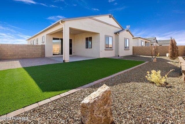 7942 E Carbon Ct Unit 20-A, Prescott Valley, AZ 86315 - back of property with stucco siding, a fenced backyard, and a patio
