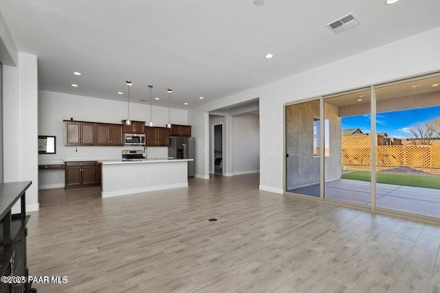 7942 E Carbon Ct Unit 20-A, Prescott Valley, AZ 86315 - unfurnished living room featuring recessed lighting and light wood finished floors