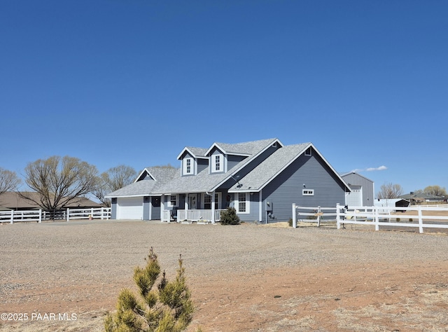 view of front of property featuring a porch and fence