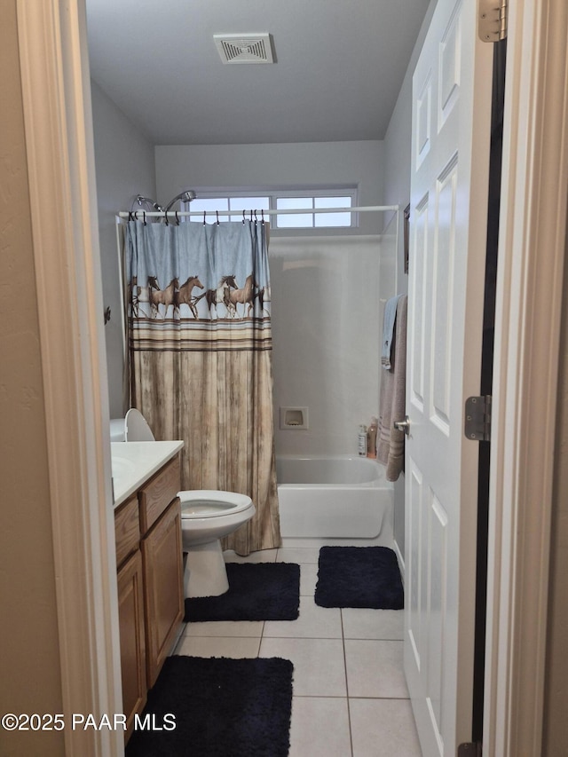 bathroom featuring vanity, visible vents, tile patterned flooring, toilet, and shower / tub combo with curtain