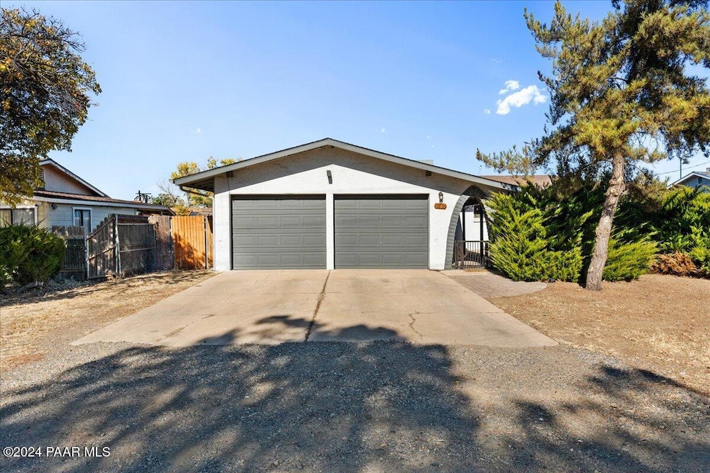 single story home featuring a garage