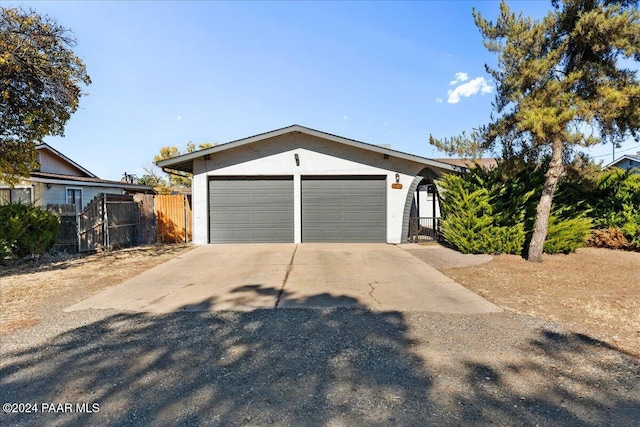 single story home featuring a garage