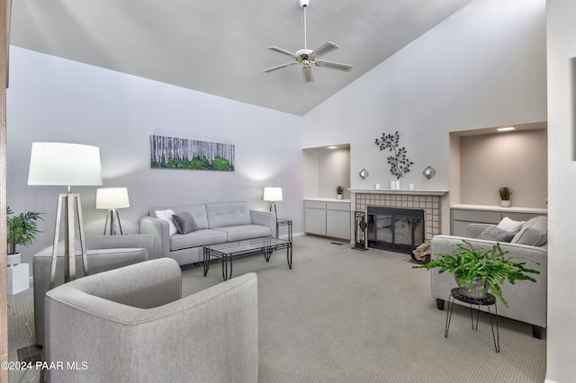 1665 Quail Run, Prescott, AZ 86303 - carpeted living room featuring high vaulted ceiling, ceiling fan, and a tile fireplace