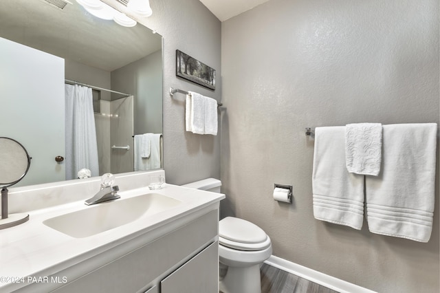 1665 Quail Run, Prescott, AZ 86303 - bathroom featuring hardwood / wood-style flooring, a shower with curtain, toilet, and vanity