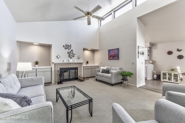 1665 Quail Run, Prescott, AZ 86303 - living room with ceiling fan, a towering ceiling, light carpet, and a tile fireplace