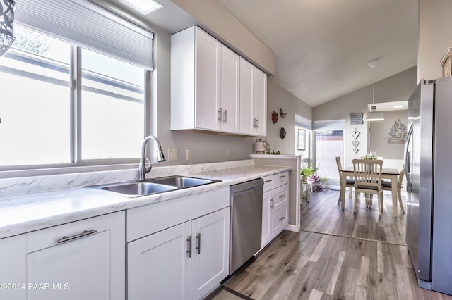 1665 Quail Run, Prescott, AZ 86303 - kitchen featuring sink, white cabinetry, stainless steel appliances, and vaulted ceiling