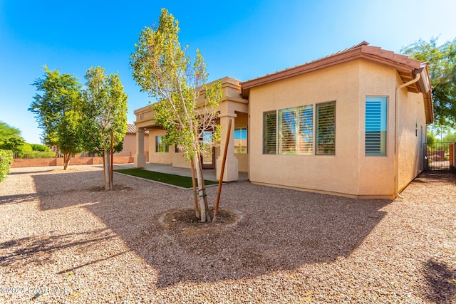 view of front of property featuring a patio