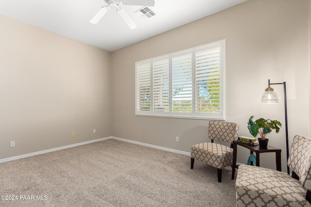 sitting room featuring carpet flooring and ceiling fan