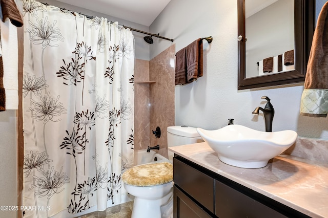bathroom with toilet, shower / bath combo with shower curtain, and vanity