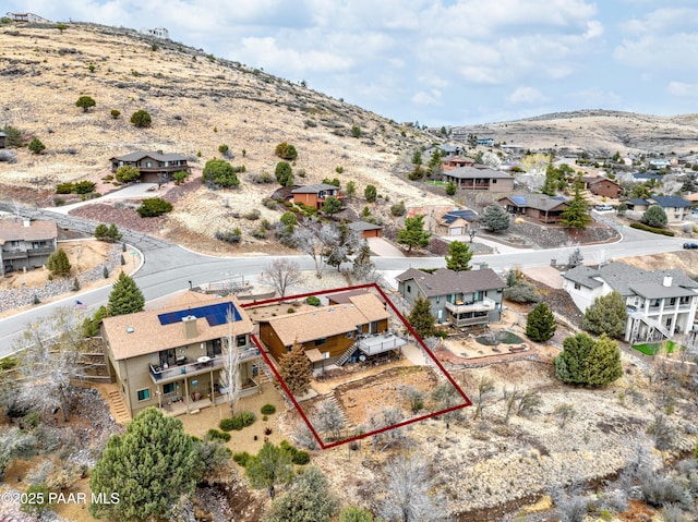 birds eye view of property with a mountain view and a residential view