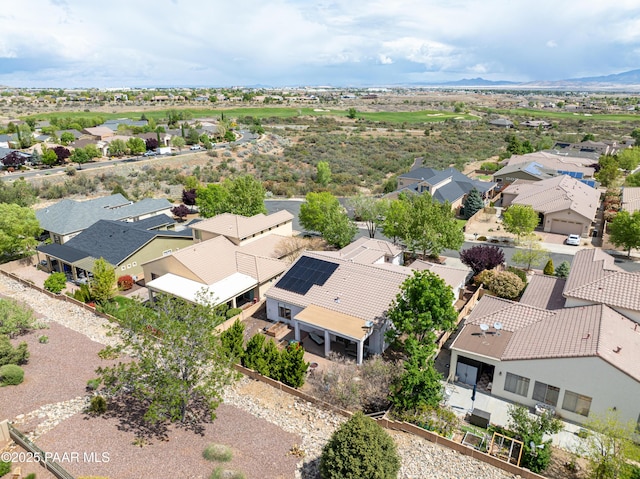 aerial view of residential area featuring a mountain backdrop