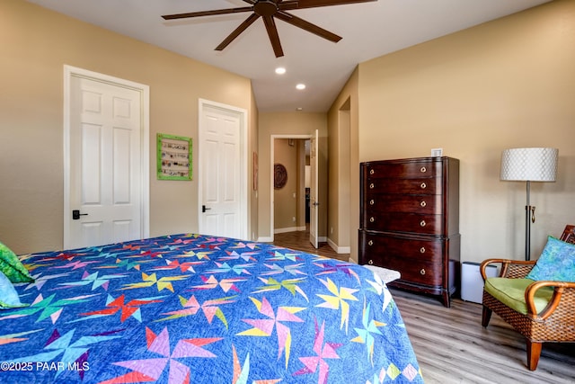 bedroom with wood finished floors, recessed lighting, and ceiling fan