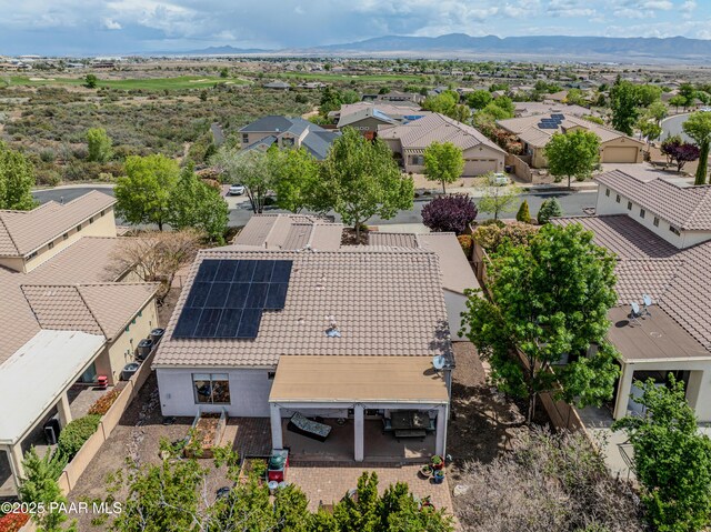 aerial view of residential area featuring a mountain backdrop