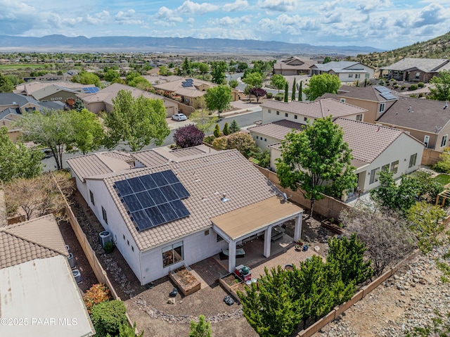 aerial perspective of suburban area featuring a mountain backdrop
