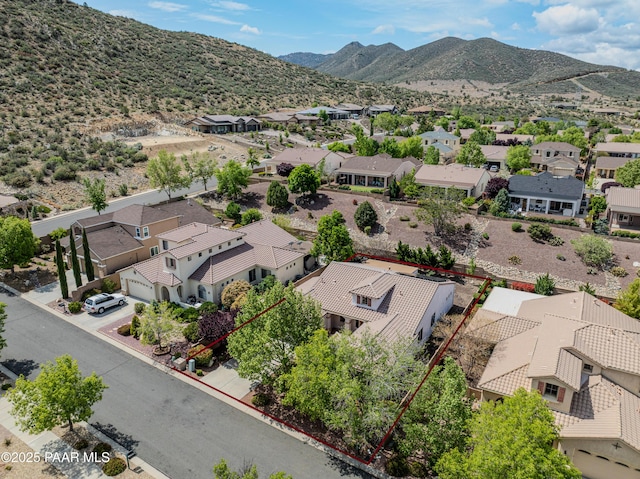 aerial perspective of suburban area with property boundaries highlighted and mountains