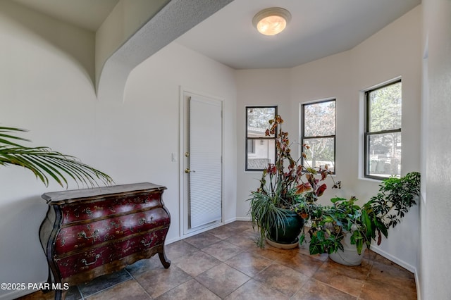 foyer entrance with baseboards