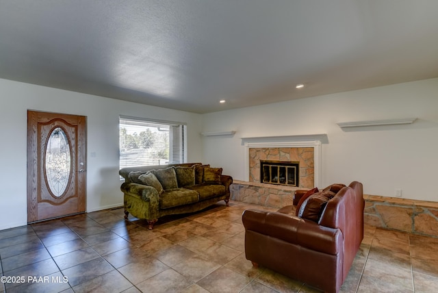 living area featuring recessed lighting and a fireplace