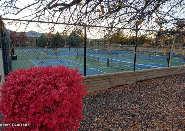 view of sport court with fence