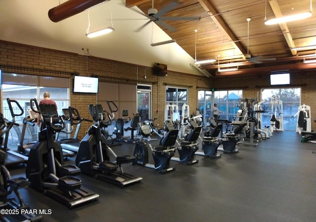 exercise room with brick wall and ceiling fan