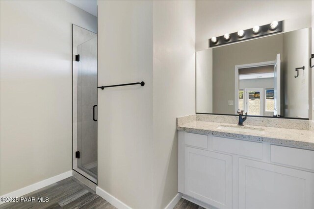 1841 N Jade Cir, Prescott, AZ 86301 - full bathroom with vanity, wood finished floors, a stall shower, and baseboards