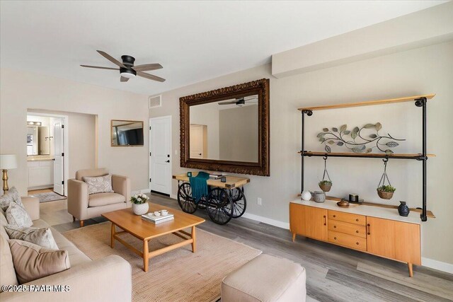 1841 N Jade Cir, Prescott, AZ 86301 - living area featuring a ceiling fan, light wood-style flooring, and baseboards