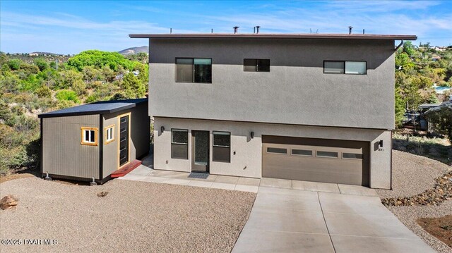 1841 N Jade Cir, Prescott, AZ 86301 - view of front of property with concrete driveway, an attached garage, and stucco siding