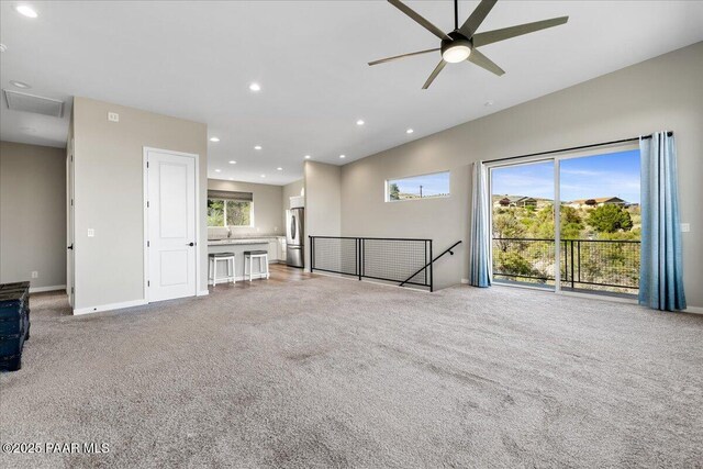 1841 N Jade Cir, Prescott, AZ 86301 - unfurnished living room with light carpet, a ceiling fan, recessed lighting, and baseboards