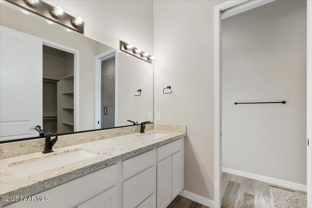 1841 N Jade Cir, Prescott, AZ 86301 - full bath featuring wood finished floors, double vanity, baseboards, and a spacious closet