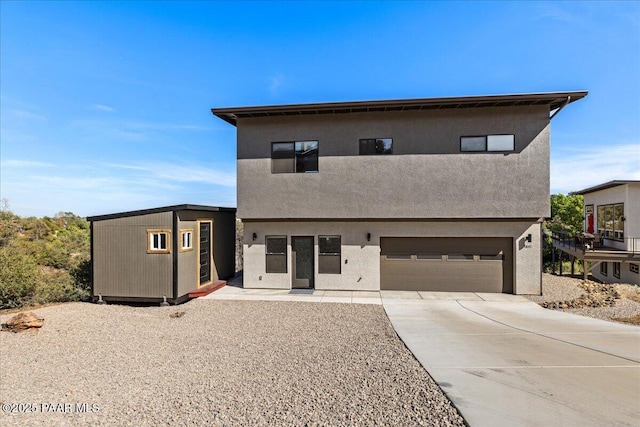 1841 N Jade Cir, Prescott, AZ 86301 - contemporary home with an attached garage, concrete driveway, and stucco siding