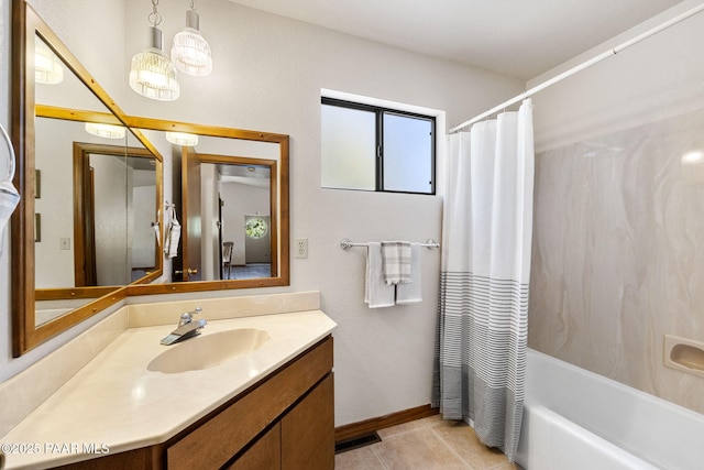 bathroom featuring vanity, baseboards, tile patterned flooring, and shower / bath combination with curtain