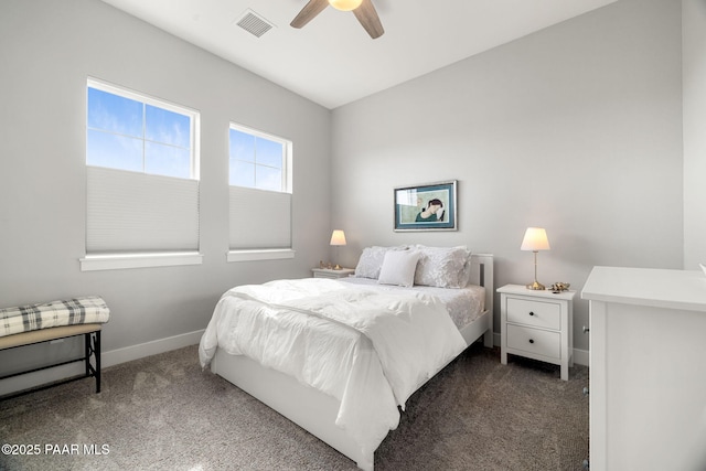 carpeted bedroom with visible vents, ceiling fan, and baseboards