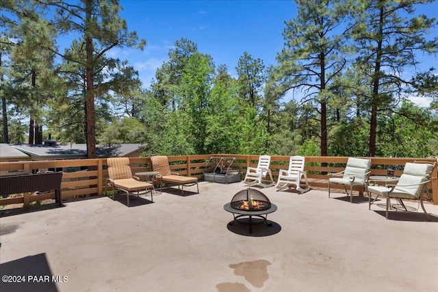 view of patio / terrace with an outdoor fire pit