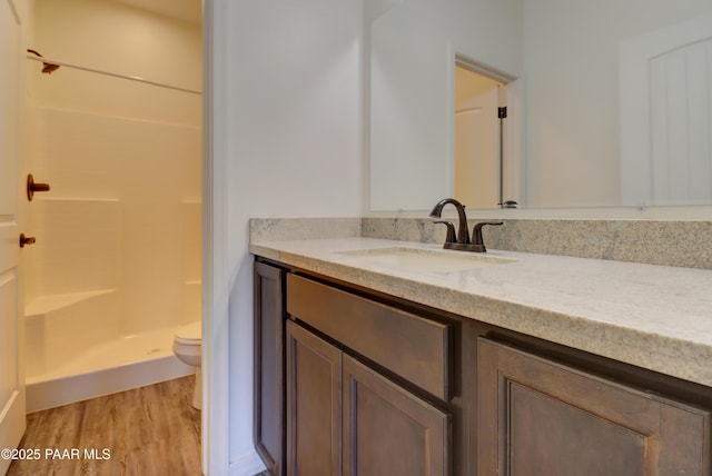 8346 Florentine Rd, Prescott Valley, AZ 86314 - full bathroom featuring wood finished floors, vanity, and a shower
