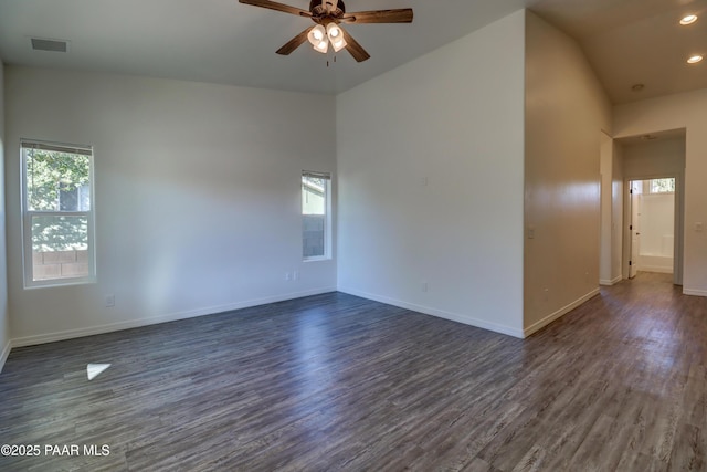 8346 Florentine Rd, Prescott Valley, AZ 86314 - empty room with plenty of natural light, a ceiling fan, dark wood-style floors, vaulted ceiling, and recessed lighting