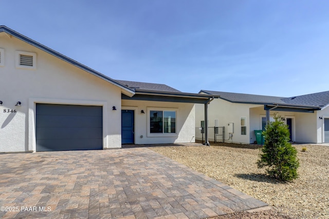8346 Florentine Rd, Prescott Valley, AZ 86314 - view of front facade with stucco siding, a garage, and decorative driveway